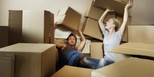 Couple with boxes who received an answer how to rent storage space.