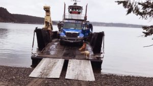 Barge delivery of a shipping container to the San Juan islands.