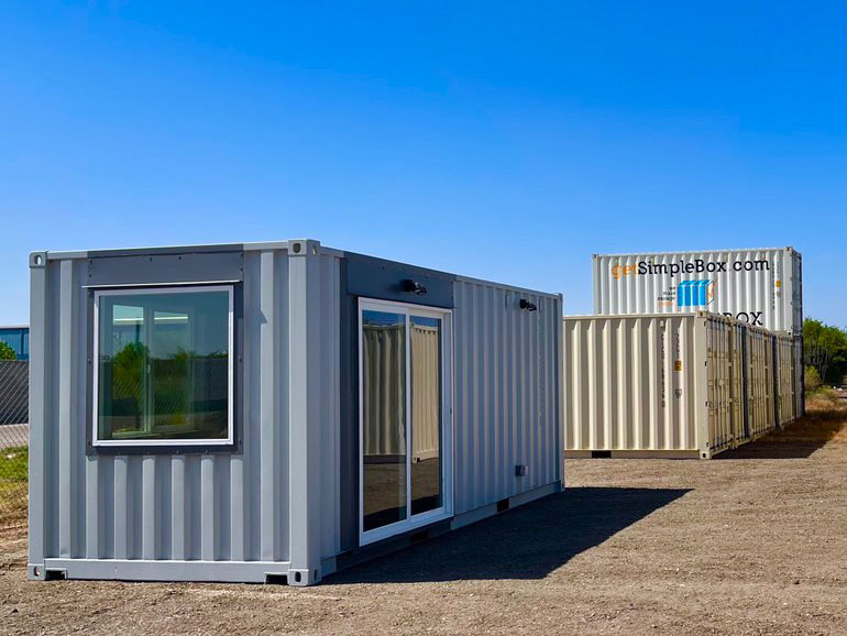 20ft shipping container office with a sliding glass door.