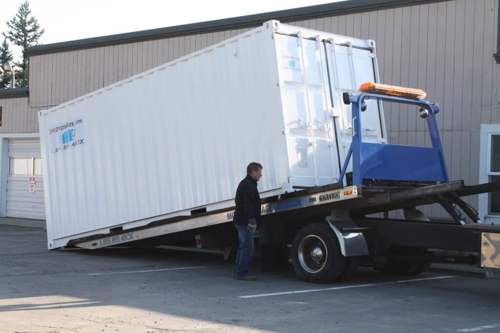 Portable storage: shipping container being delivered