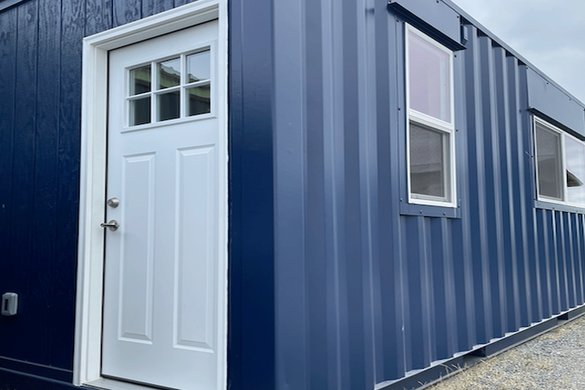 Modified shipping container with customized shipping container paint