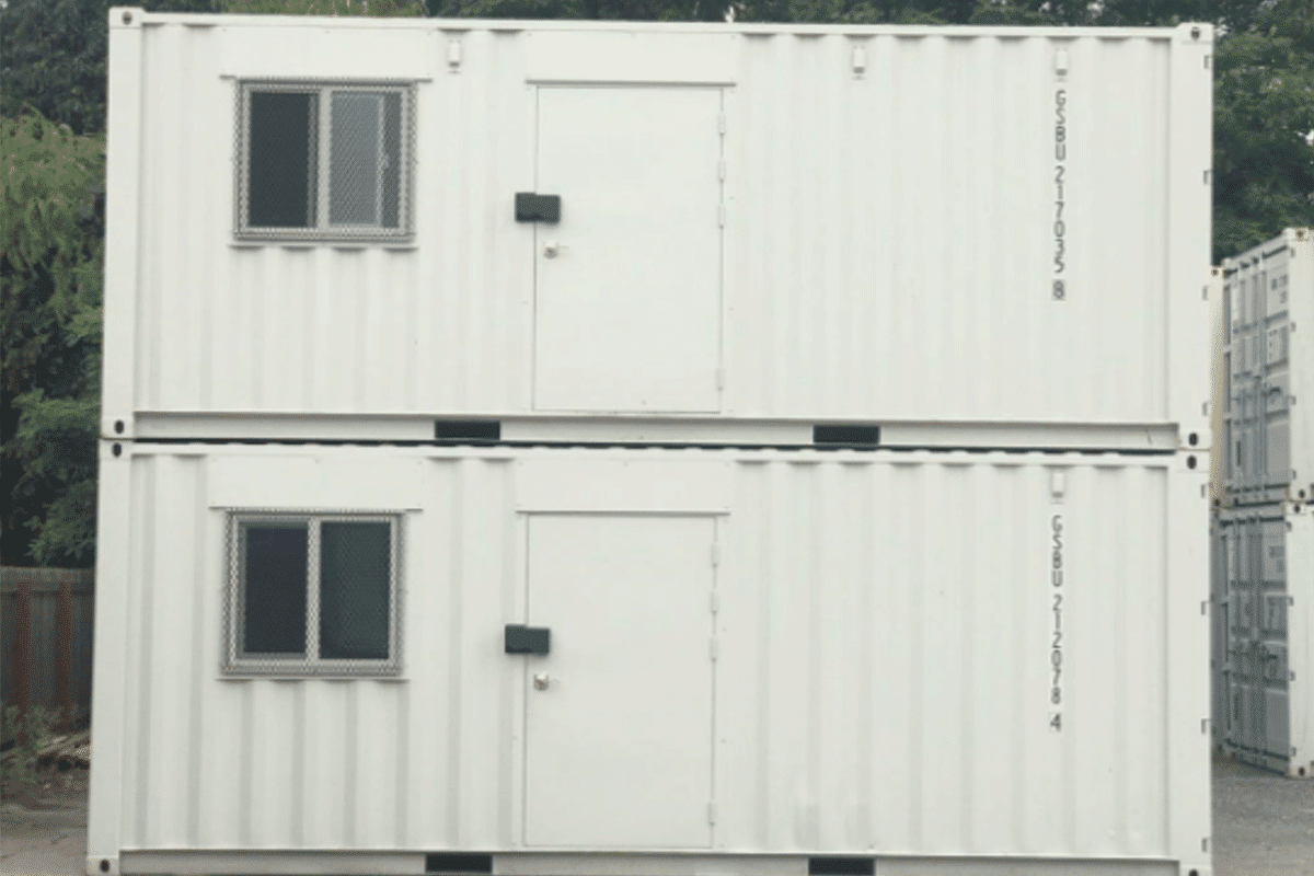 Two 20 feet shipping containers stacked on top of each other