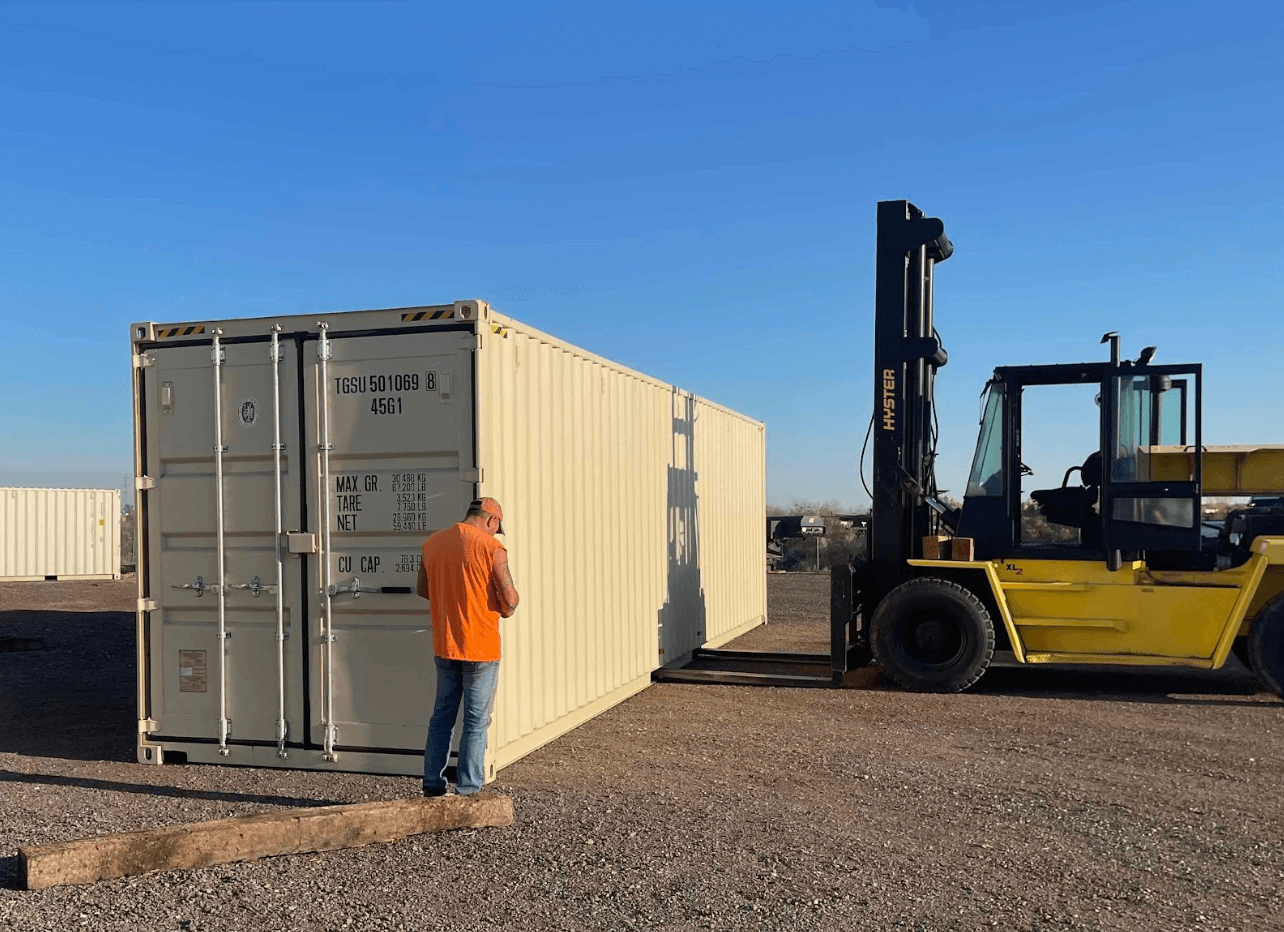 Driver with orange shirt inspecting 40 foot shipping container