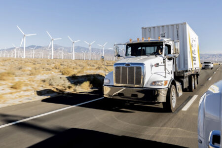 driver transporting portable storage container on the road