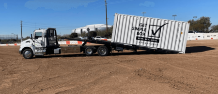 Truck unloading a 20 foot shipping container for an individual who is using shipping containers for moving