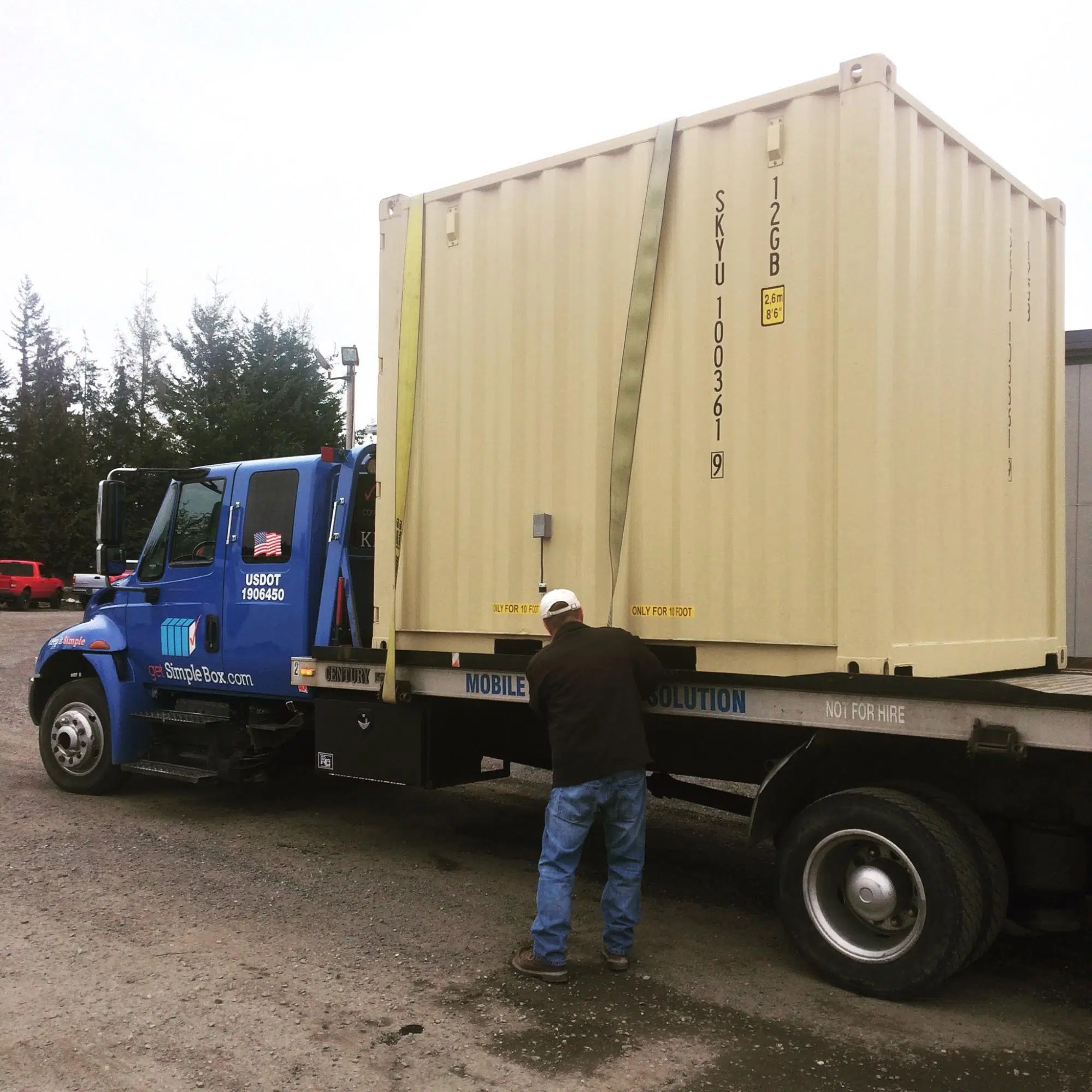 10 foot shipping container ready to be delivered loaded at a truck.