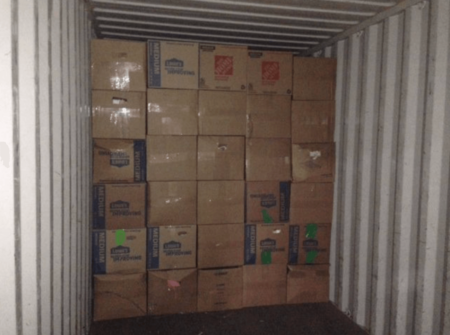 Shipping container with cardboard boxes packed perfectly with packyourself moving containers