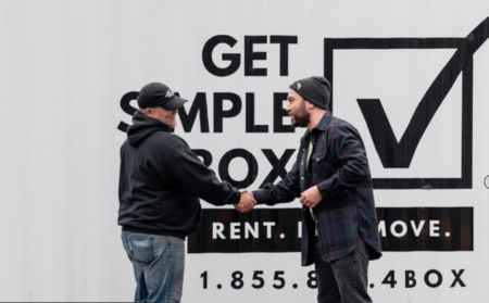 Get Simple Box employee and client shaking hands because of a happy experience deliverig moving container