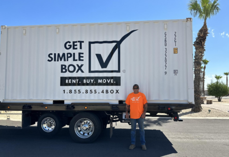 Shipping container rental from Get Simple Box being delivered to a yard