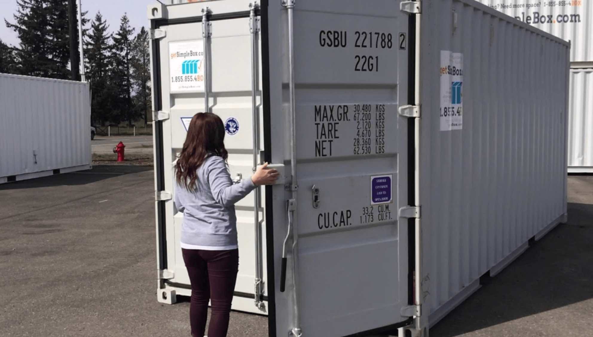 Client comparing containers vs mini storage options before renting or buying