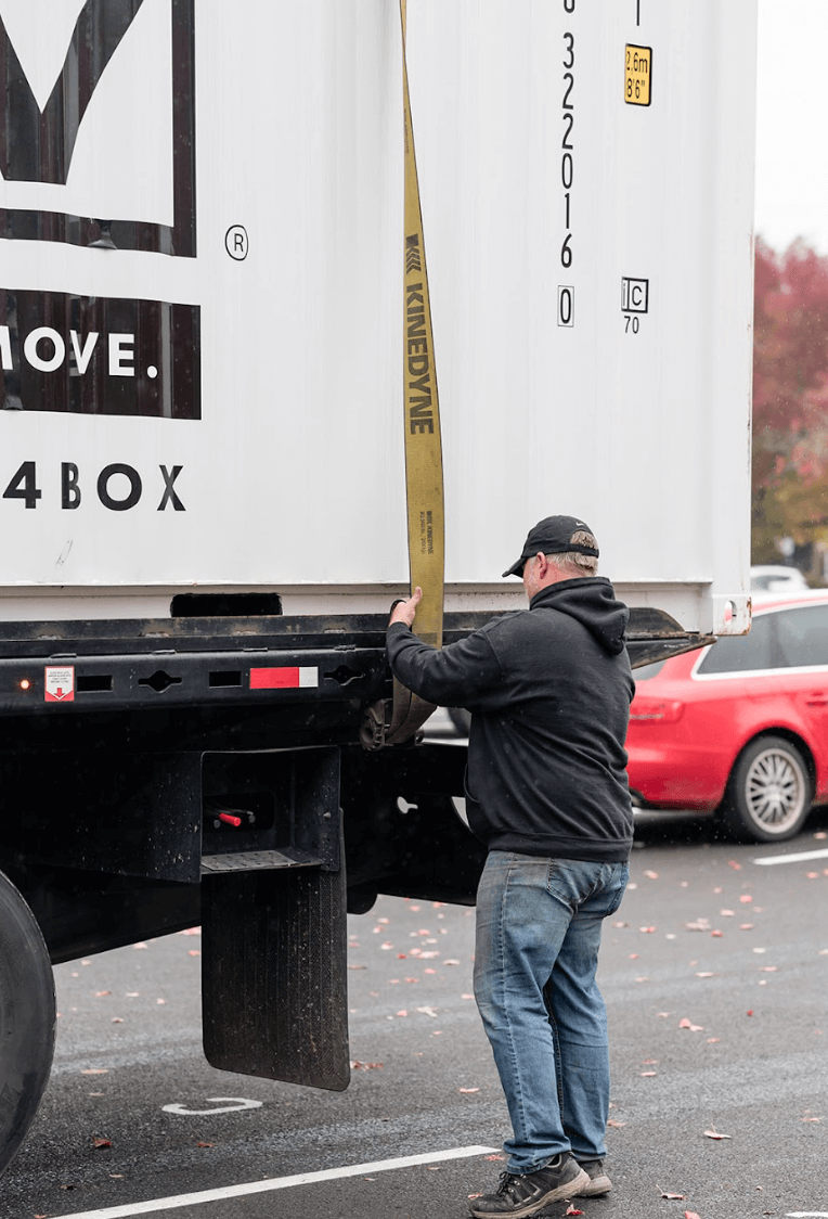 Get Simple Box team getting the shipping container secured before being delivered