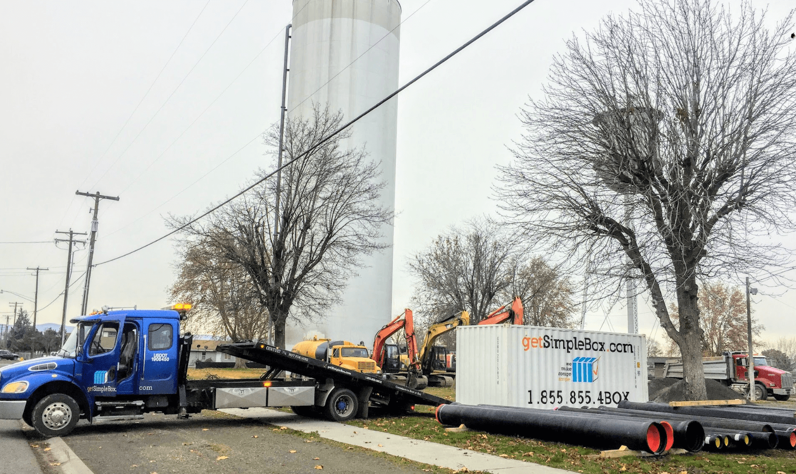 Moving containers being delivered to a construction site