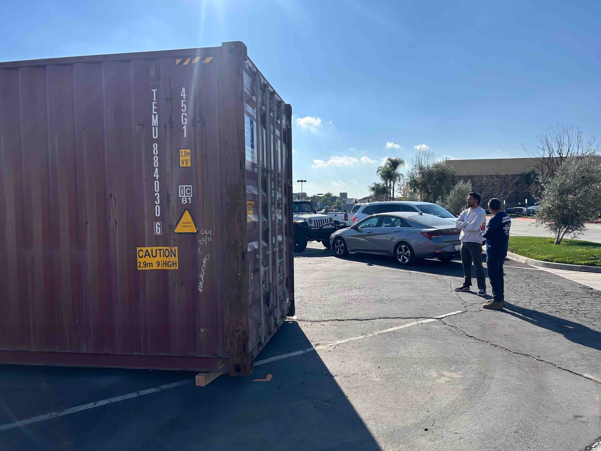 Team members from Harvest Fellowship and Get Simple Box oversee container delivery for wildfire relief efforts.