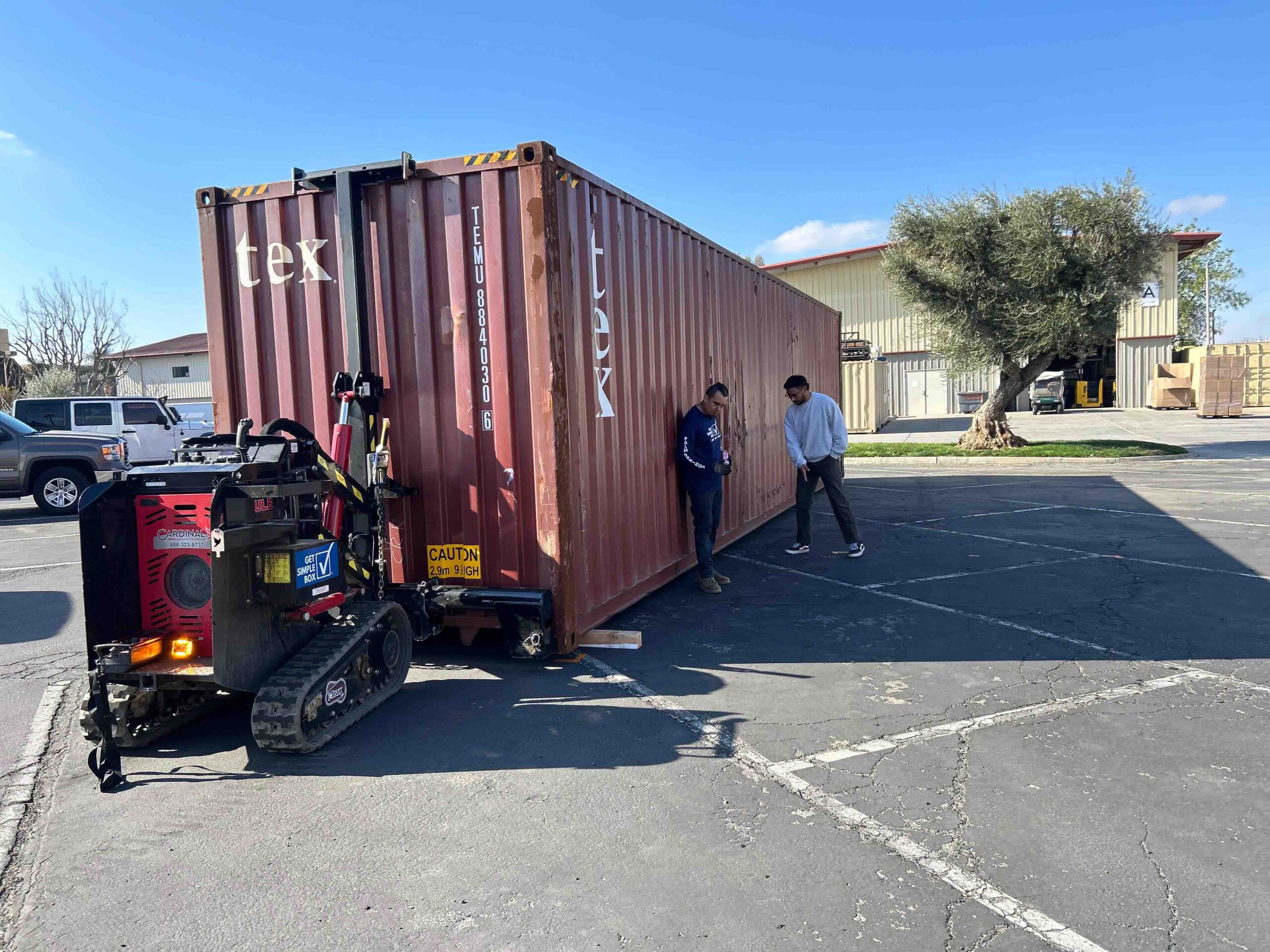 Jose Ortiz of Get Simple Box uses the BoxBot system to position a 40-foot container for disaster relief.