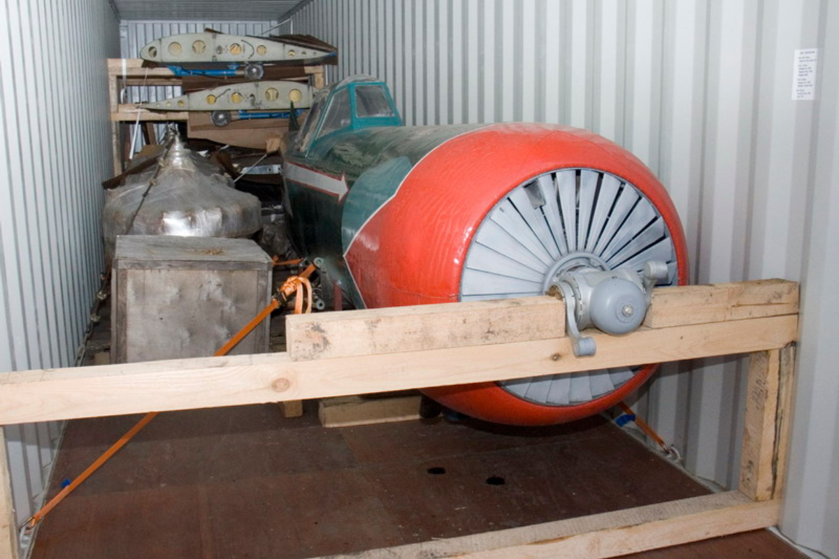 A small personal airplane stored inside a 40ft high-cube shipping container