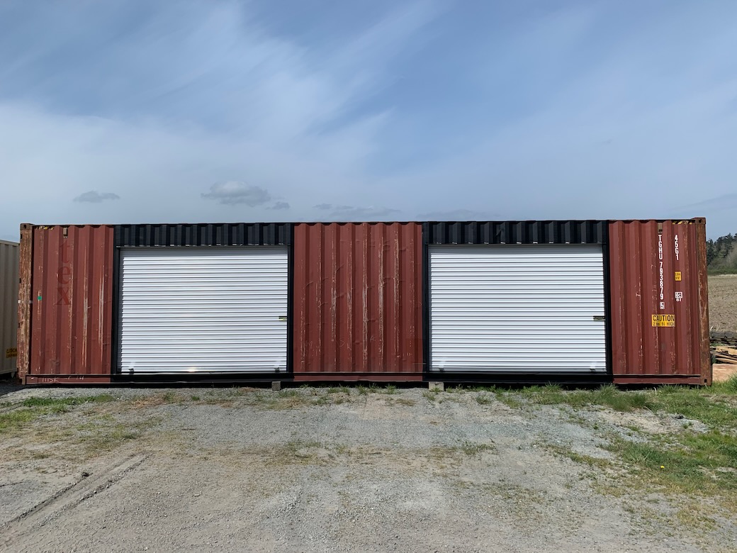 A customized unit featuring roll-up doors, showcasing shipping containers for sale in Everett, WA for permanent workshop use