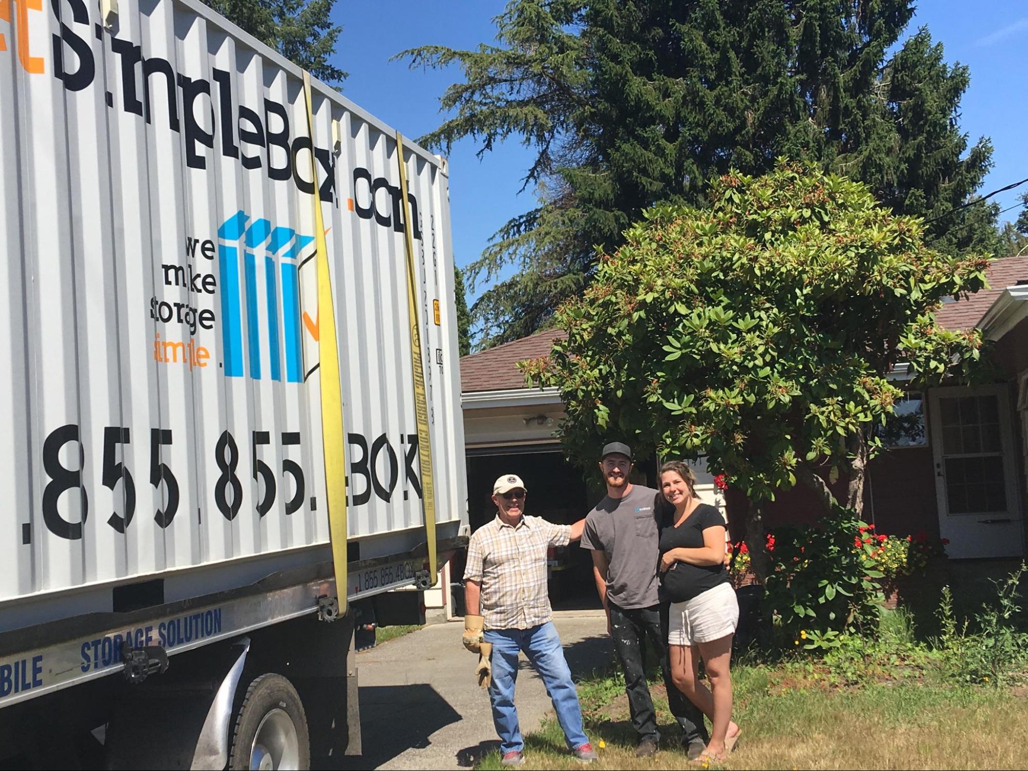 A friendly Get Simple Box team member chatting with a customer next to a delivered unit, highlighting upfront communication and clear moving container rental details. 