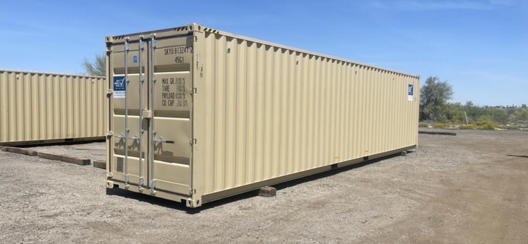 A heavy-duty 40-foot shipping container sitting level on a gravel yard.