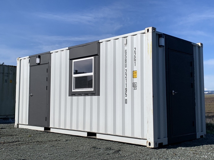 A pristine Get Simple Box 1-trip container serves as the perfect blank canvas. It is already cut and framed by our expert team for custom man-door and window installation.