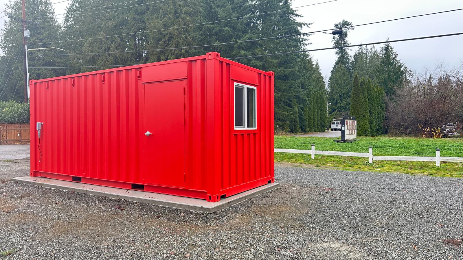 Close-up of a storage container sitting on blocks for site preparation, ensuring it remains level regardless of standard shipping container dimensions