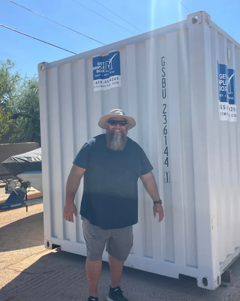 Customer standing beside a delivered white storage container