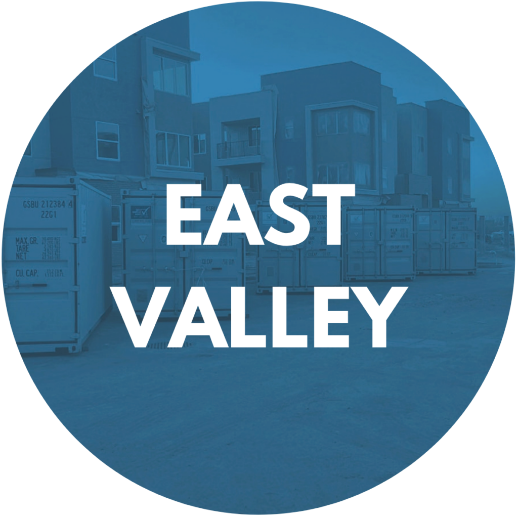 East Valley service area badge with storage containers in the background
