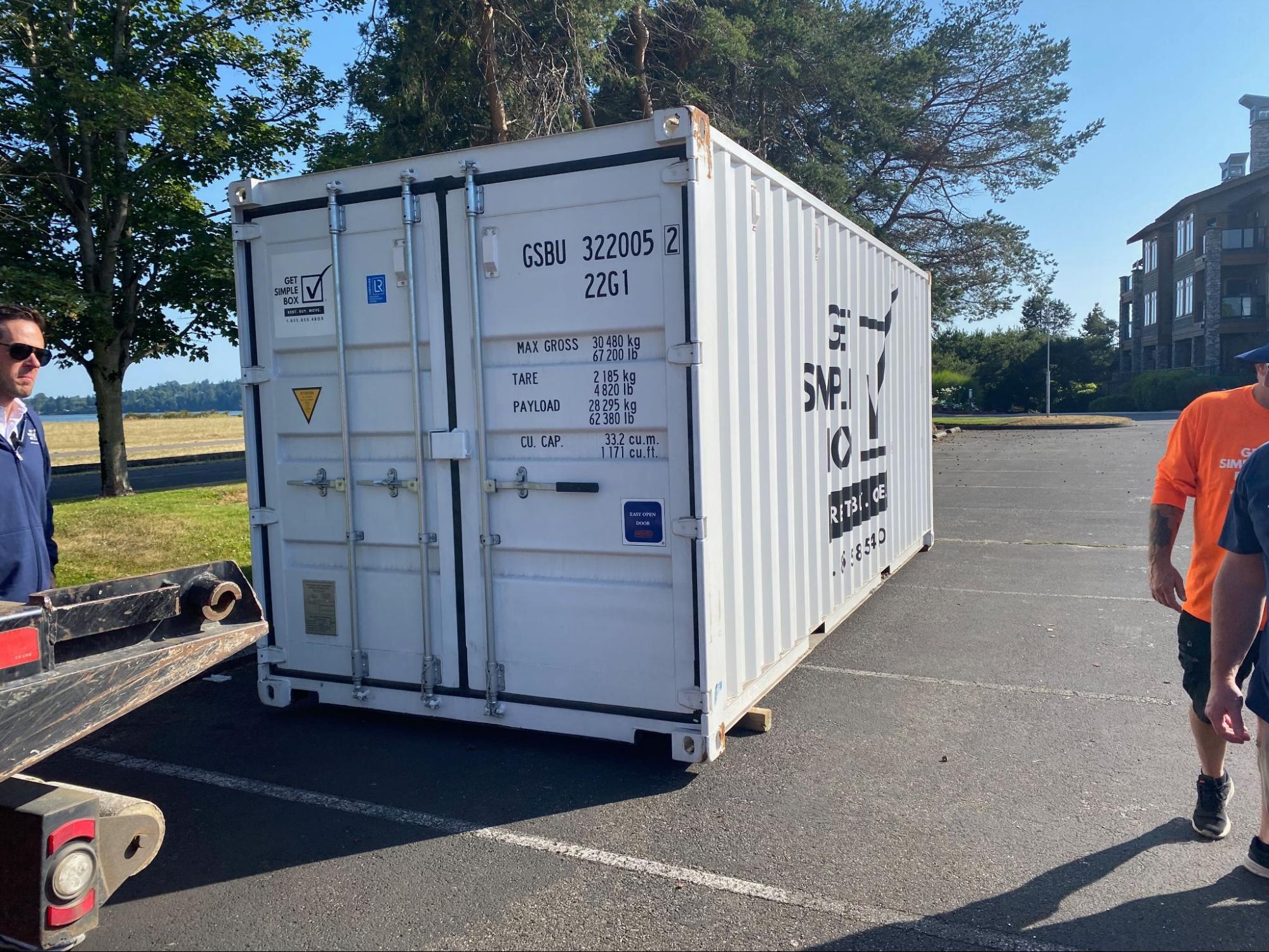 Inside a storage container in Dallas, OR, showing items organized on pallets with a 3-inch air gap between boxes and steel walls to prevent condensation and "container rain"