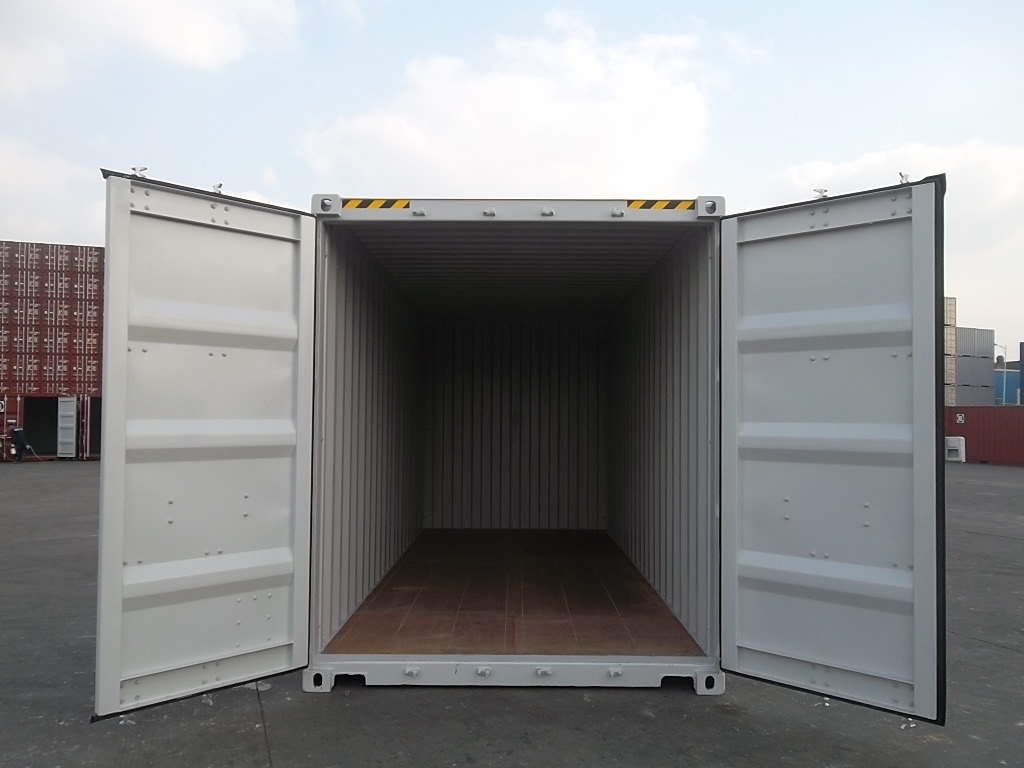 Open doors of a 20-foot shipping container swinging fully outward to 270 degrees, showing proper clearance away from a residential fence.