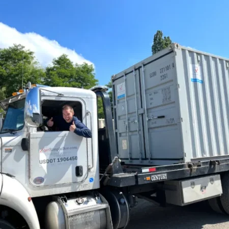 Driver smiling from a Get Simple Box delivery truck