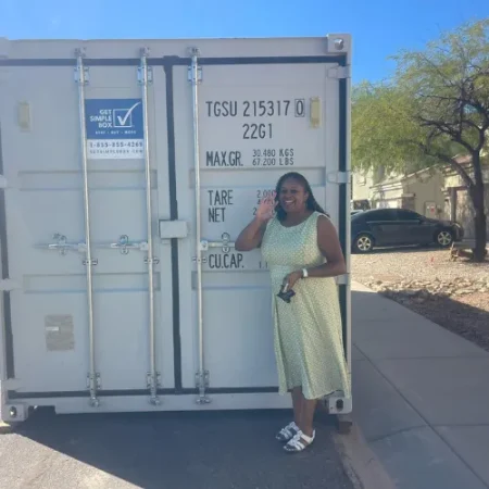 Customer standing beside a delivered white storage container