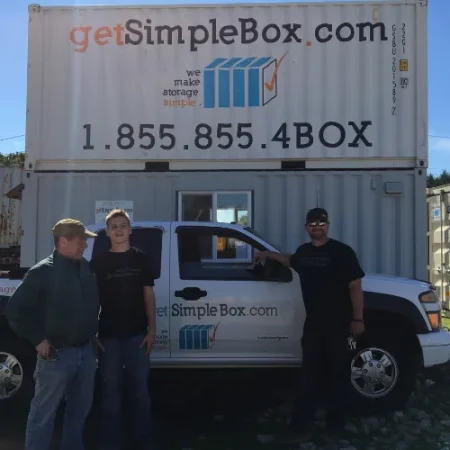Get Simple Box team standing beside a company truck and stacked containers
