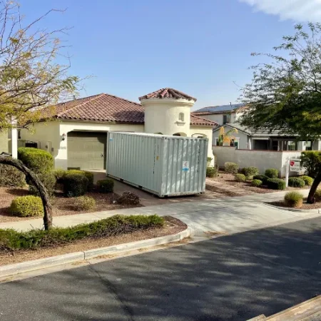 White storage container delivered in front of a residential home