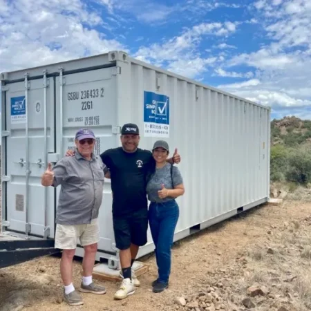 Customers standing beside a delivered Get Simple Box container
