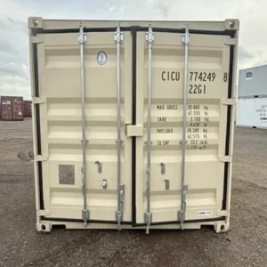 White shipping container with closed cargo doors in a yard