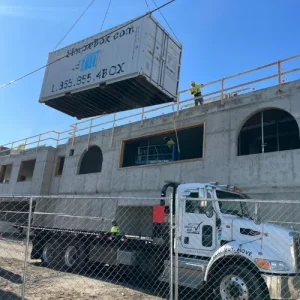 Get Simple Box container being lifted onto a construction site