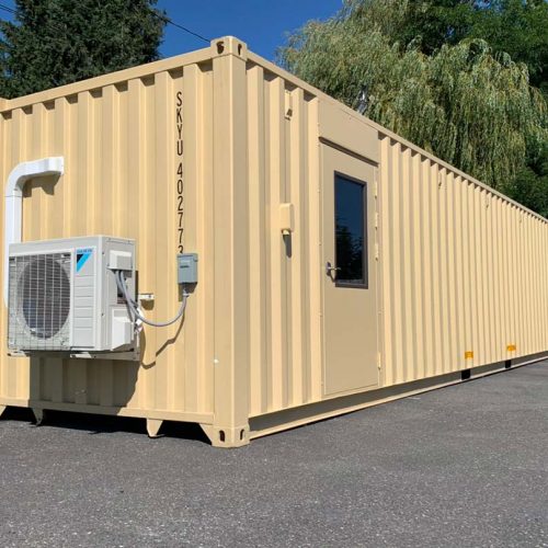 Modified 40ft shipping container with a pedestrian door and a mini-split hvac.
